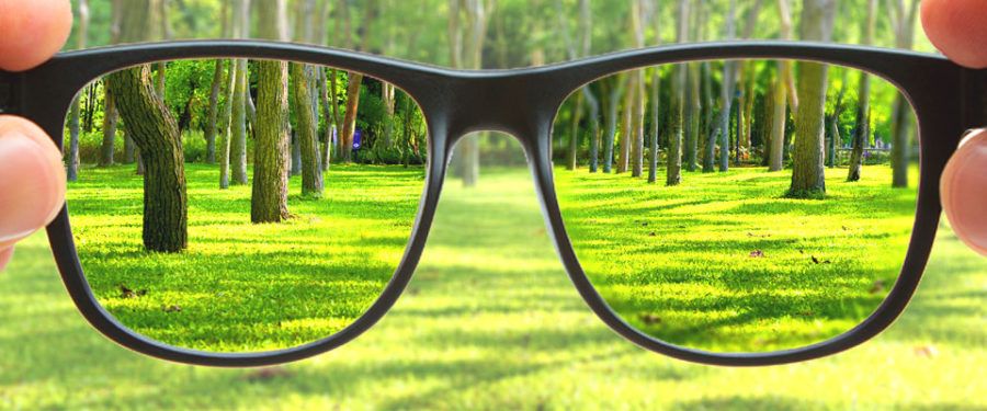 Seeing clearly looking through a pair of glasses while everything outside of it is blurry